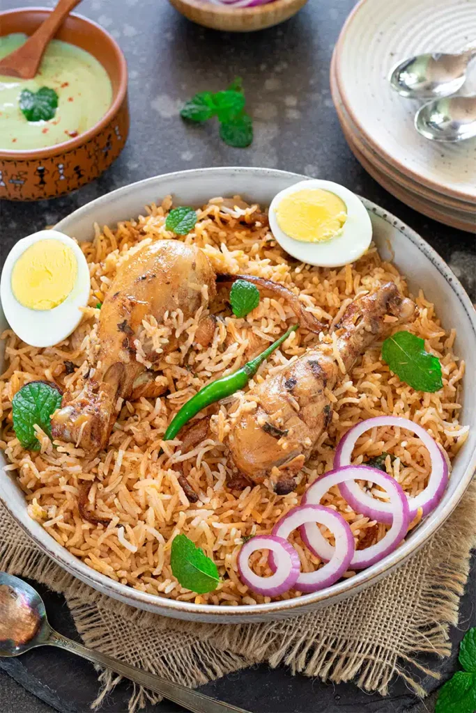 Chicken Biryani served with raita and salad